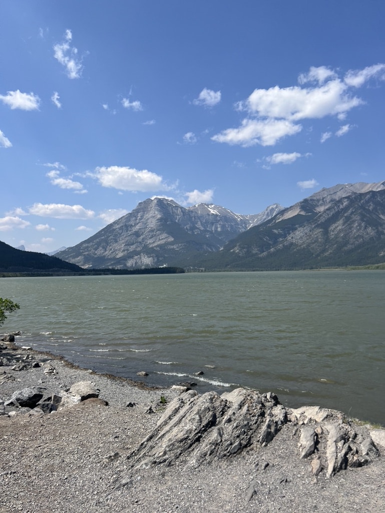 15 Pros and Cons of Living in Calgary: Ultimate 2024 Guide 3 Exshaw with the Rocky Mountains on the side of the highway about 1 hour from Calgary. The best place to spend a great day in the summer if you live in Calgary