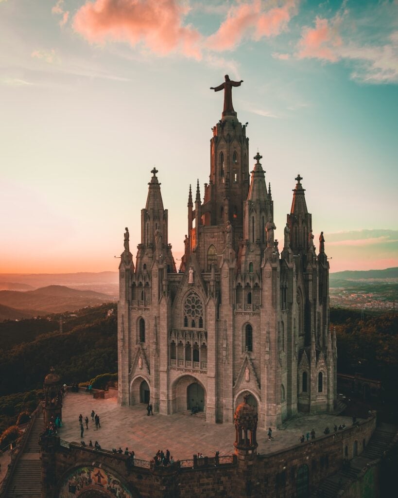 27 Pros and Cons of Living in Spain in 2024 6 brown cathedral during daytime in Spain. Spain is a very religious country