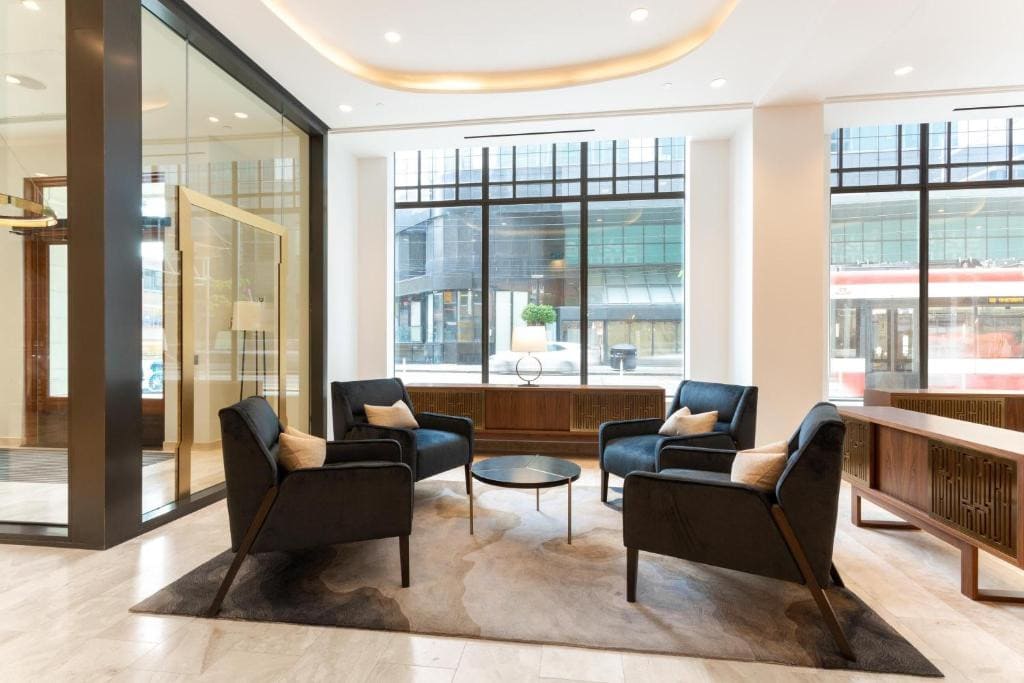Where To Stay In Toronto: Best Areas And Hotels in 2024 7 A minimalist, elegant lobby area of King Blue Hotel in Toronto.