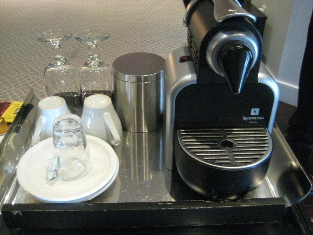 22 Best Places to Stay in Montreal Canada 20 A coffee maker beside cups and saucers placed on top of a tray. You can have a delicious breakfast when you stay in Le Relais Lyonnais in Montreal Canada.