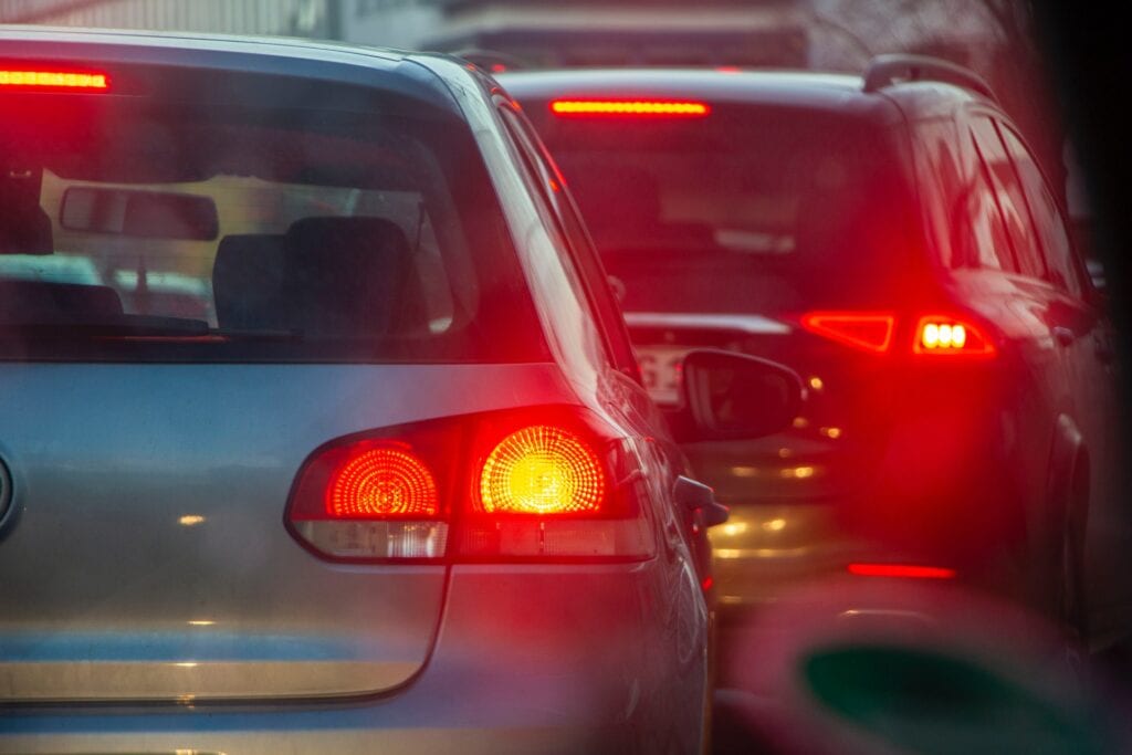 27 Pros and Cons of Living in Tennessee in 2024 3 Two cars with their lights on, lining up in the highway. Public Transportation is unreliable in Tennessee that's why owning or renting a car is the best option to get around the city,