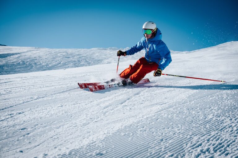 25 Pros and Cons of Living in New Hampshire in 2024 9 man ice skiing on hill