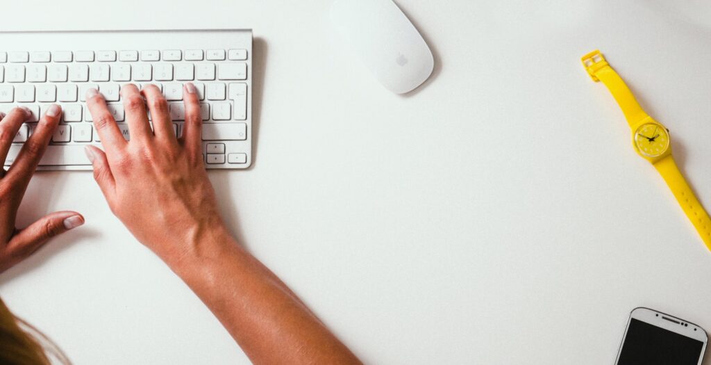 25 Pros and Cons of Living in New Hampshire in 2024 10 person typing on Apple Cordless Keyboard