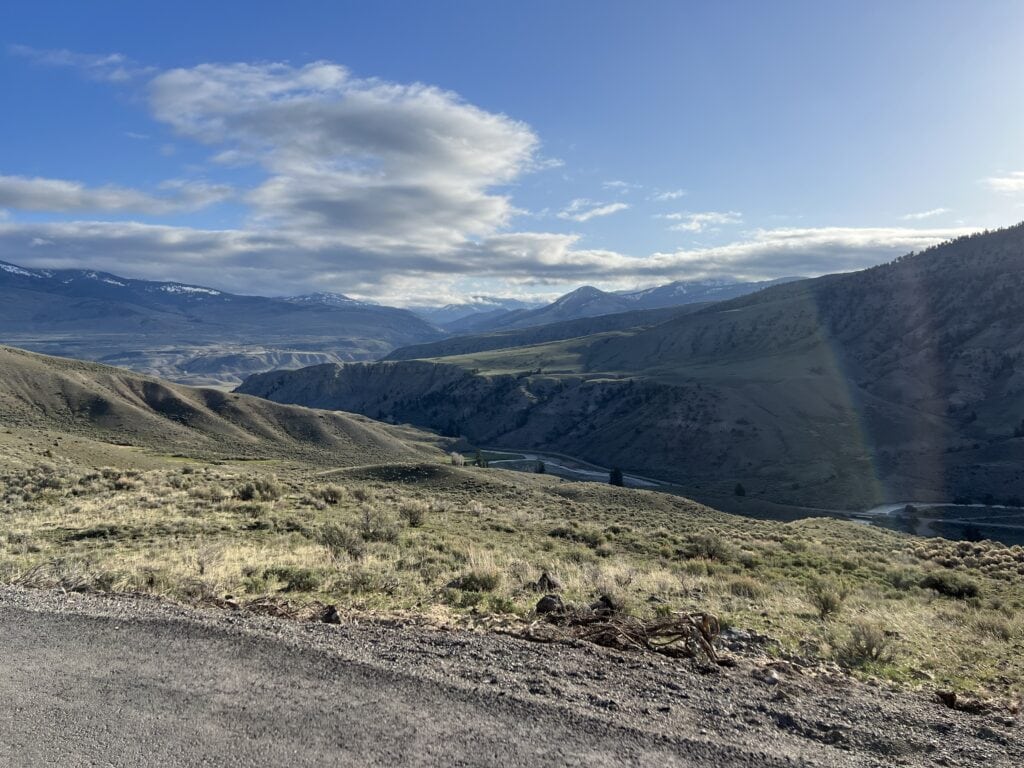 23 Pros and Cons of Living in Wyoming (2024) 8 Wyoming rolling mountain views in Yellowstone National Park when I visited
