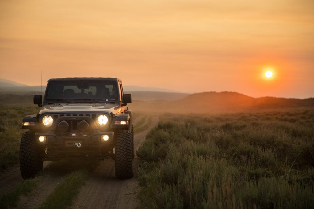 Renting A Car In Puerto Rico (2024) - All You Need To Know 3 black jeep wrangler on green grass field during sunset