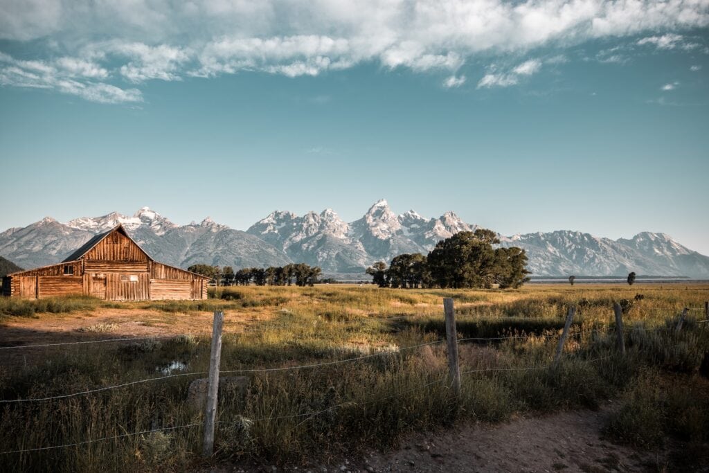 23 Pros and Cons of Living in Wyoming (2024) 2 brown house near trees during daytime in Jackson Hole