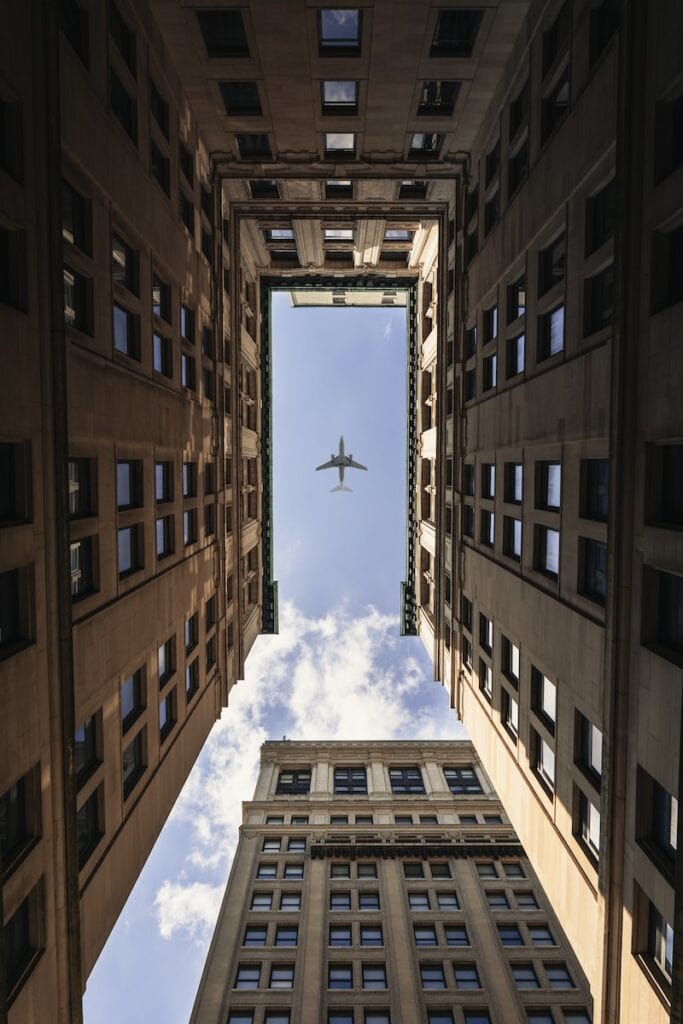 29 Pros and Cons of Living in Virginia in 2024 2 airplane flying on top of high rise buildings in Virginia
