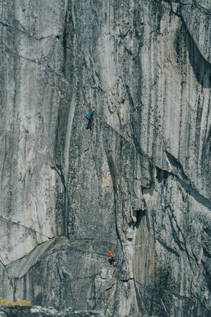 These are the Best Outdoor Adventures Near the US/Canada Border 7 a group of people climbing a rock in Squamish.