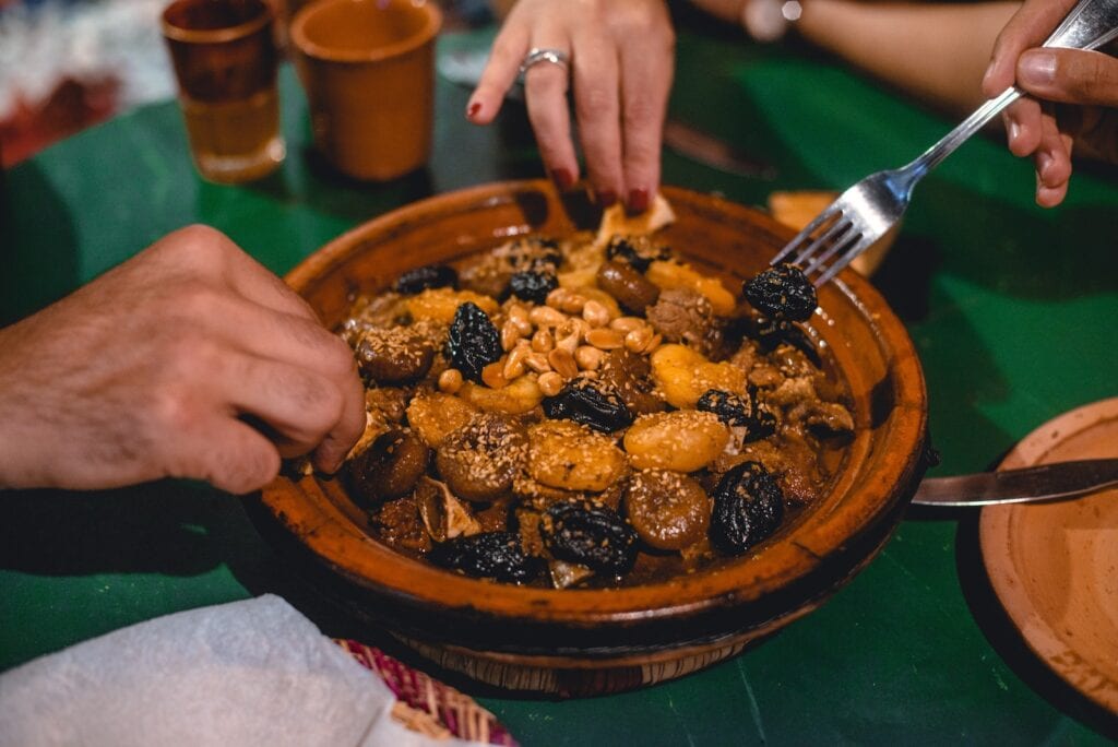 11 Best Cooking Classes in Marrakech in 2024 6 a person eating a bowl of food