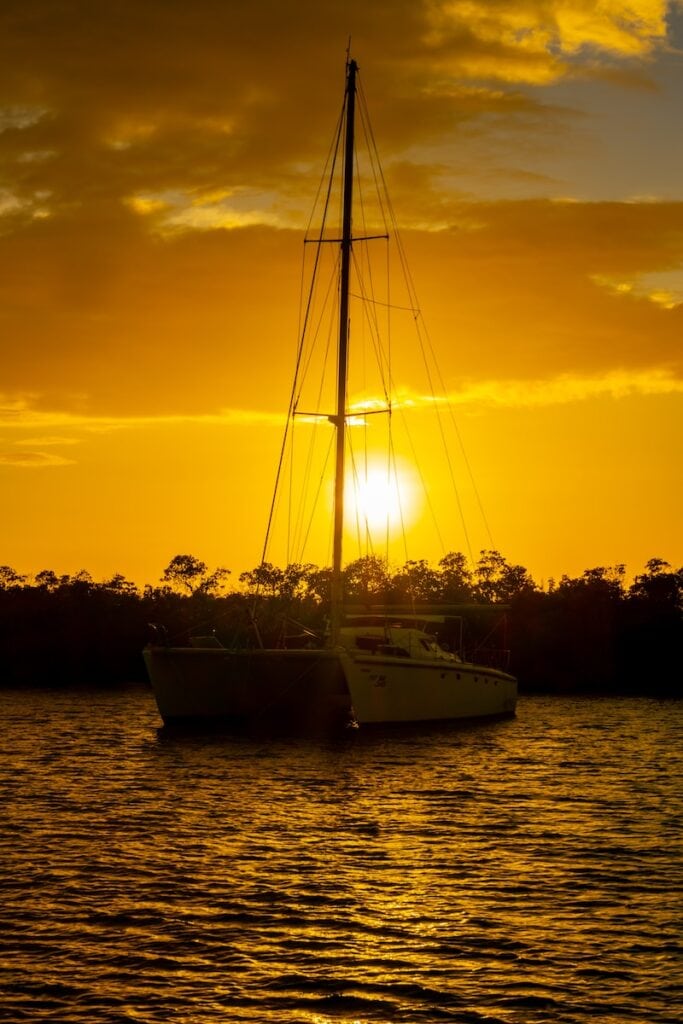 17 Best Snorkeling Tours in Puerto Rico in 2024 11 a sailboat in a body of water at sunset