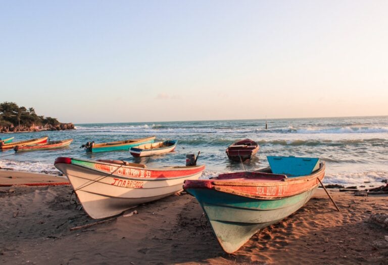 These Were the Most Popular Travel Destinations in 2023, According to Google Trends 10 white and blue boat on beach during daytime in Jamaica.