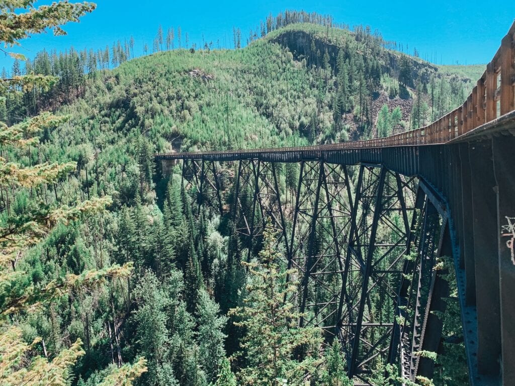 These are the Best Outdoor Adventures Near the US/Canada Border 6 a train on a bridge at Kettle Valley Rail Trail.