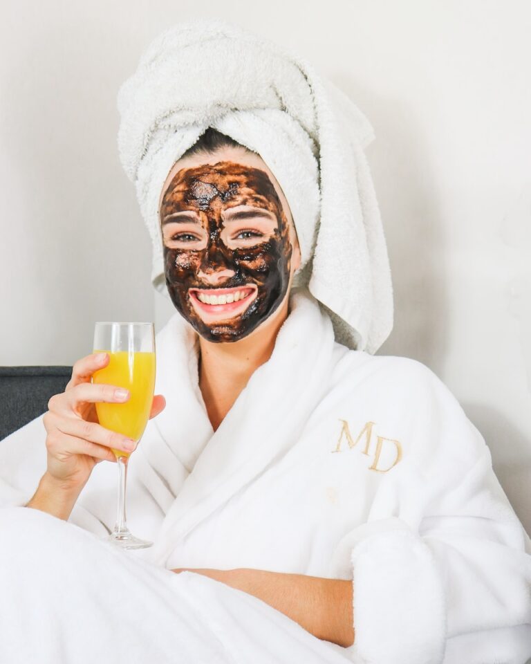 9 Best Spas in Quebec City For Ultimate Relaxation 3 man in white bathrobe holding clear drinking glass with a mimosa.