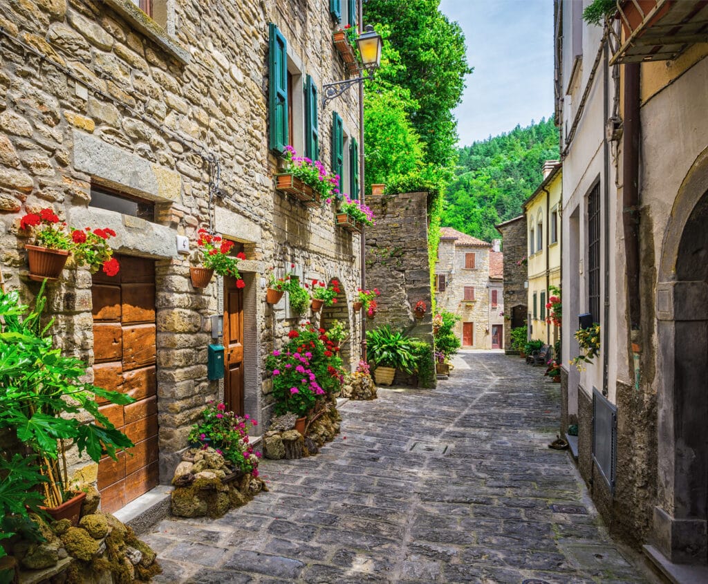 Things I Took For Granted Until I Moved to Italy 2 Typical Italian street in a small provincial town of Tuscan, Italy, Europe with gardens and cobblestones.