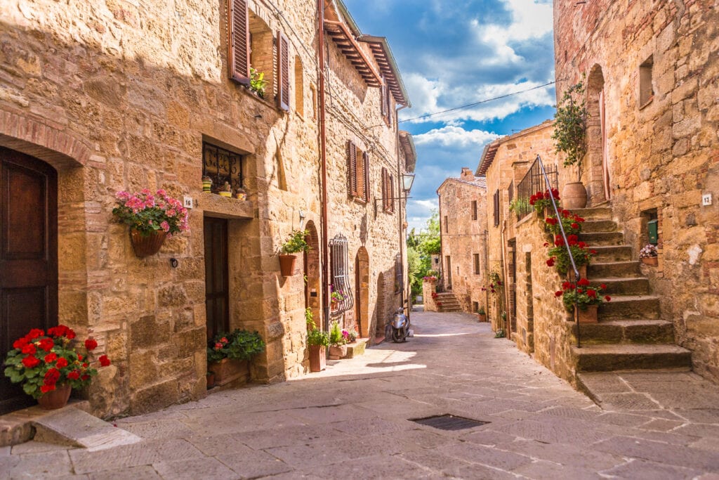 Things I Took For Granted Until I Moved to Italy 4 Small town in Italy with tan stone buildings and narrow cobblestone streets.