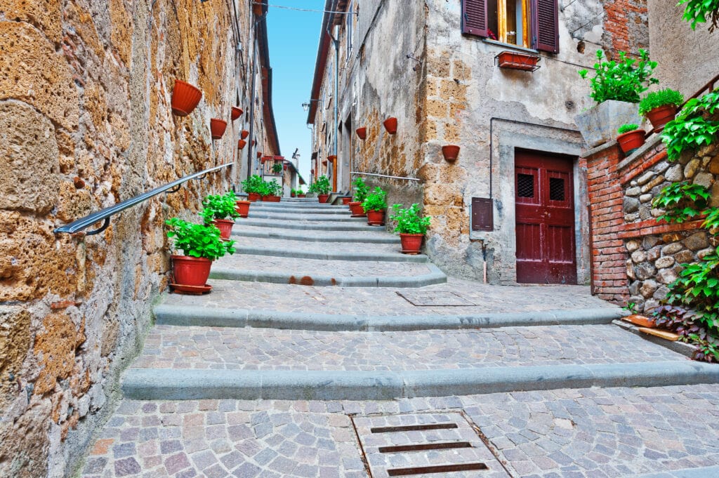 Things I Took For Granted Until I Moved to Italy 8 Staircase of the Narrow Street with Old Buildings in the Medieval Italian City.