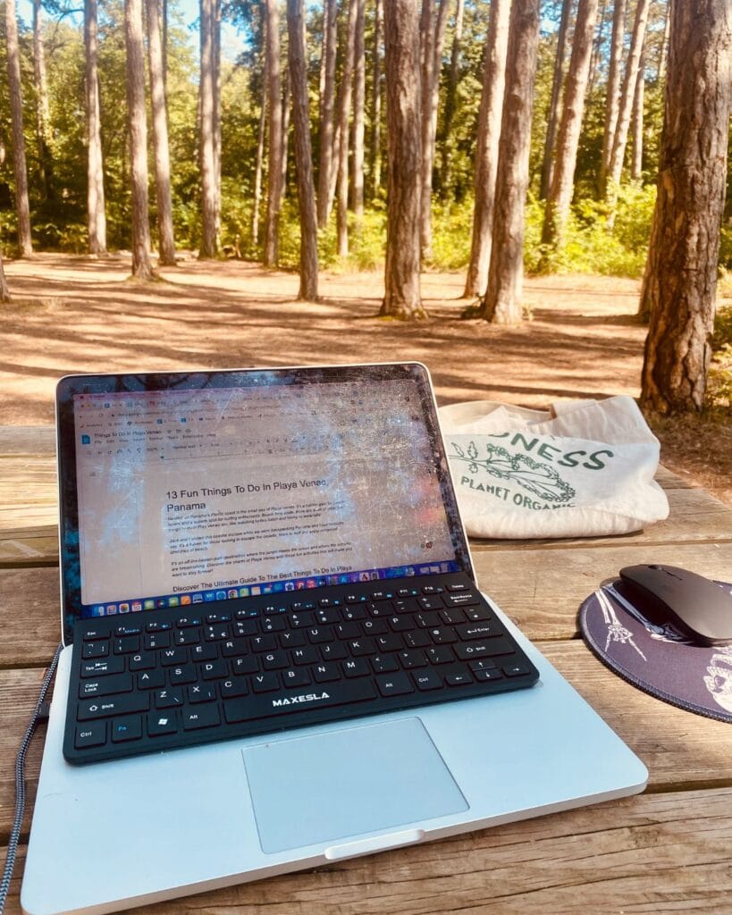This Expat Traded London Life for Bali's Laidback Tropics 5 Abi's laptop as she writes a blog post about Panama at a campsite for her digital nomad work.