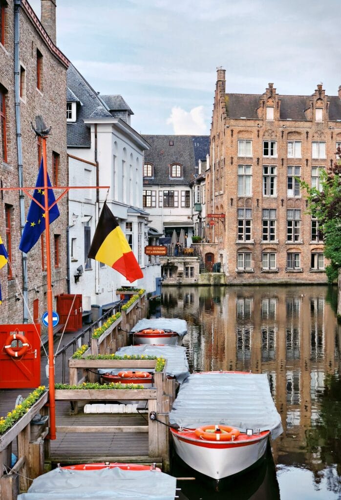 14 Top Freelance Visa Countries To Live And Work In 2024 12 A dock with 4 boats by a river in Belgium.