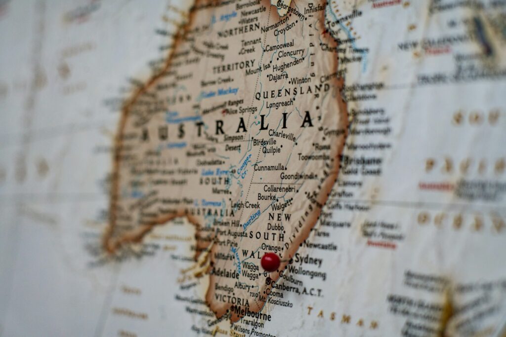 19 Reasons Not To Move To Australia In 2024 3 A close up image of the map of Australia with a red pin.