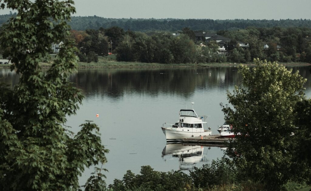 15 Best Places to Retire in Canada (From a Local Canadian!) 15 A boat on the lake in th Fredericton.
