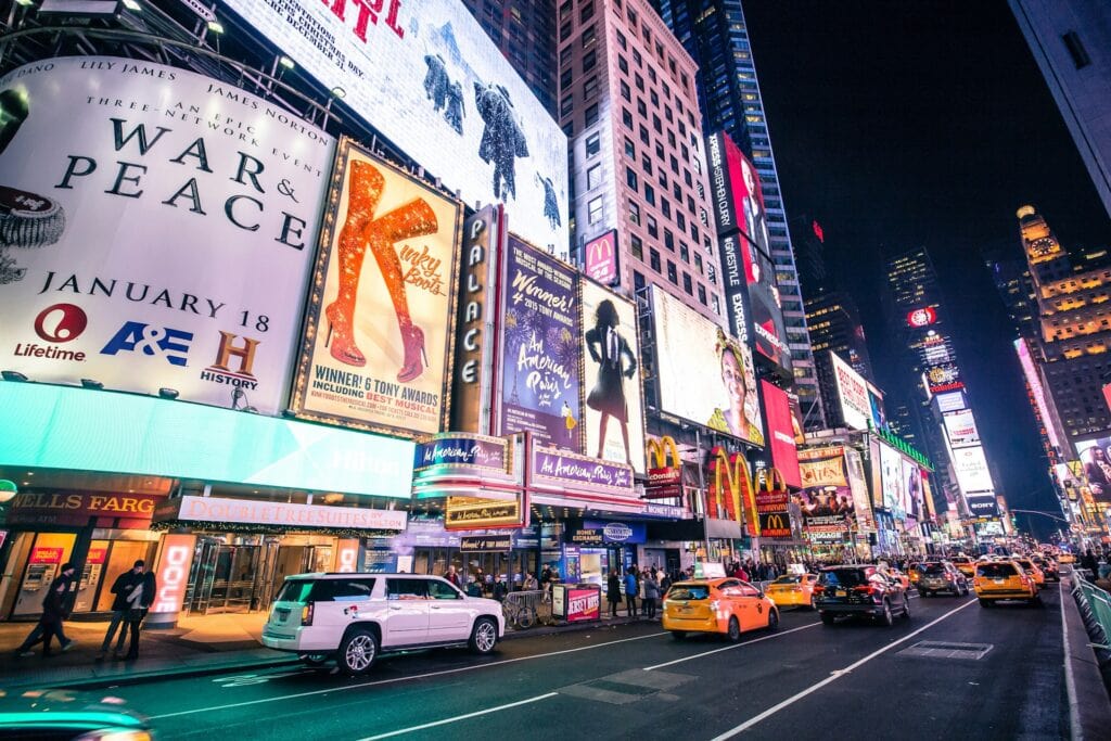 11 Reasons to Live in the US 5 A busy street at night with huge signages that light up.