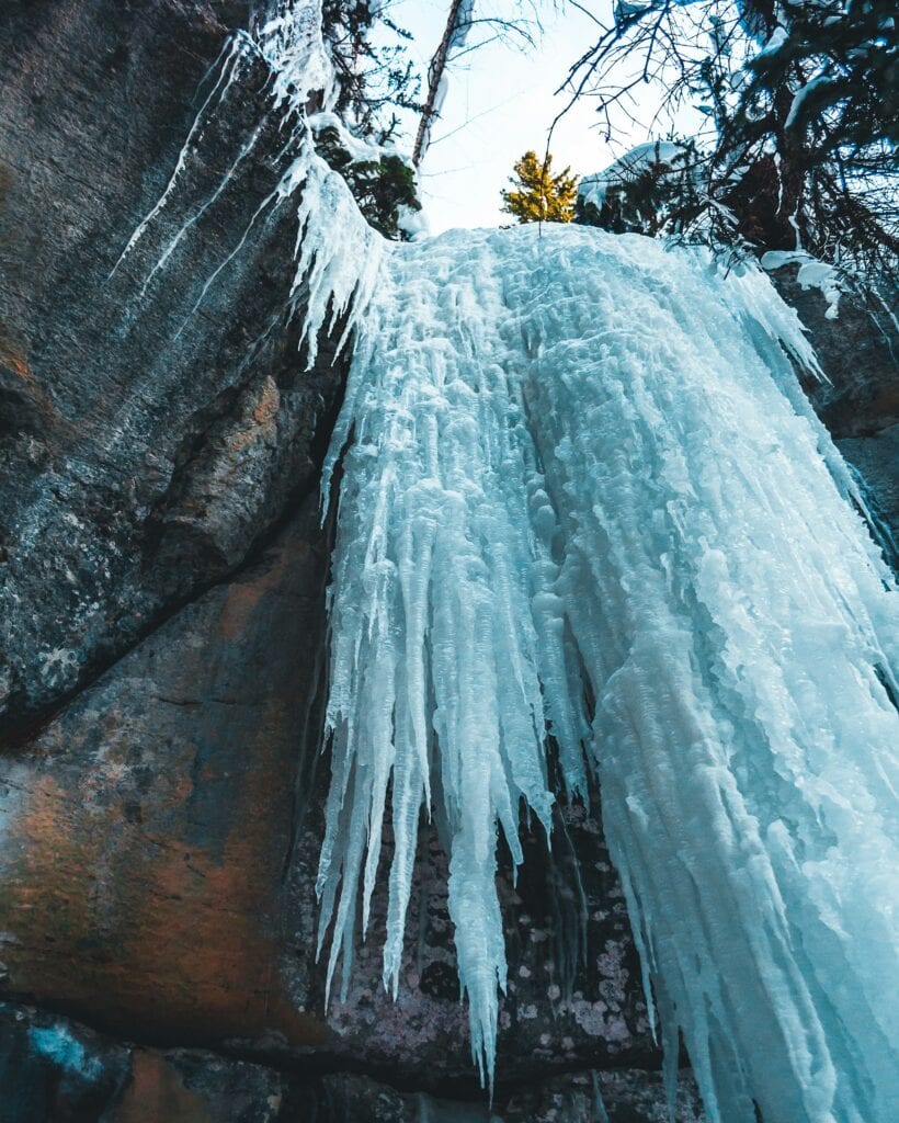 9 Must-See Natural Wonders in Canada That Are Perfect for Your Winter Getaway 7 The frozen water at Jean-Larose Falls during winter.