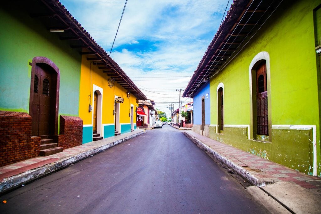Top 17 Countries With Retirement Visas (2024 Guidelines) 4 A street with colorful houses in Nicaragua.