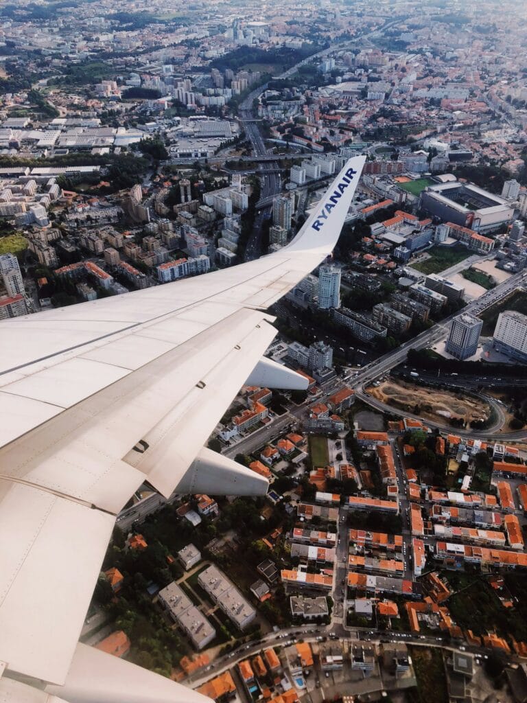 Retiring In Ireland: Pros And Cons (From an Expat!) 5 The view out the window of a Ryan Air flight going over a European city