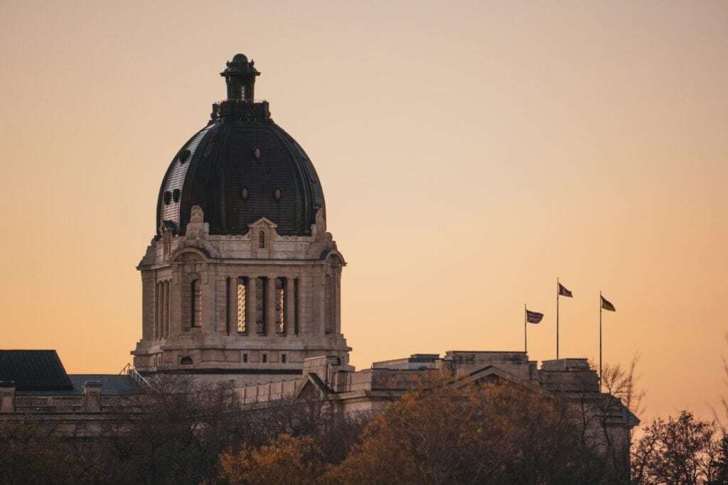 15 Best Places to Retire in Canada (From a Local Canadian!) 13 A tower in a n old building during sunset in Regina, Saskatchewan.