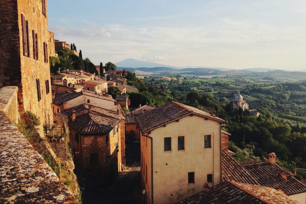 13 Countries That Will Pay You To Move There (Expat’s Picks) 5 Old brown houses line up in the mountain in Sicilly, Italy.