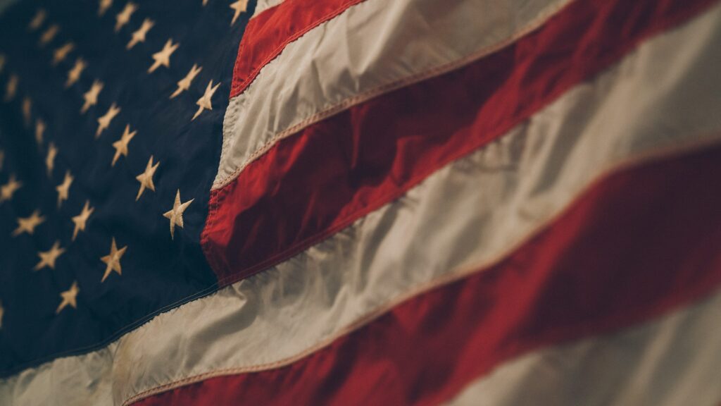 Cost of Living in Canada vs US (Complete 2024 Comparison) 9 A close up photo of the American flag.