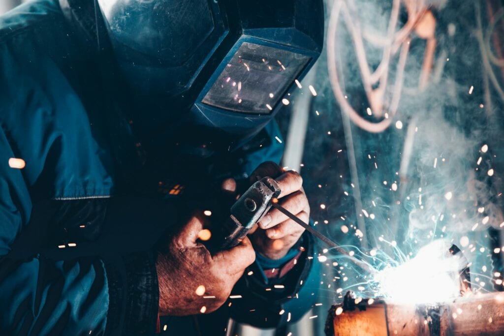 19 Reasons Not To Move To Australia In 2024 17 A man working as a welder.